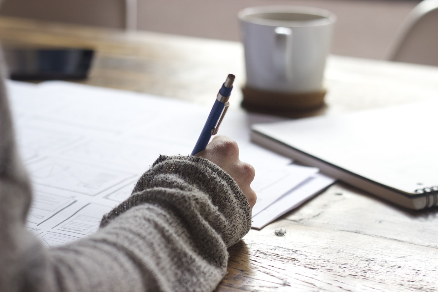 Notebook and desk set up for reviewing AI-assisted work skills exercises